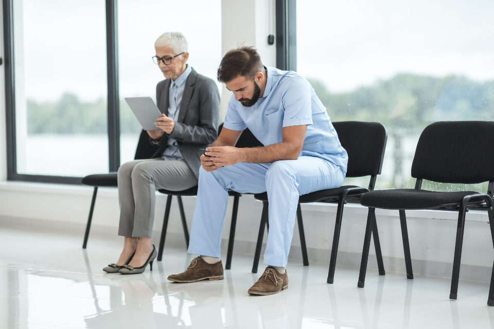 Patients seated in a clinic waiting area